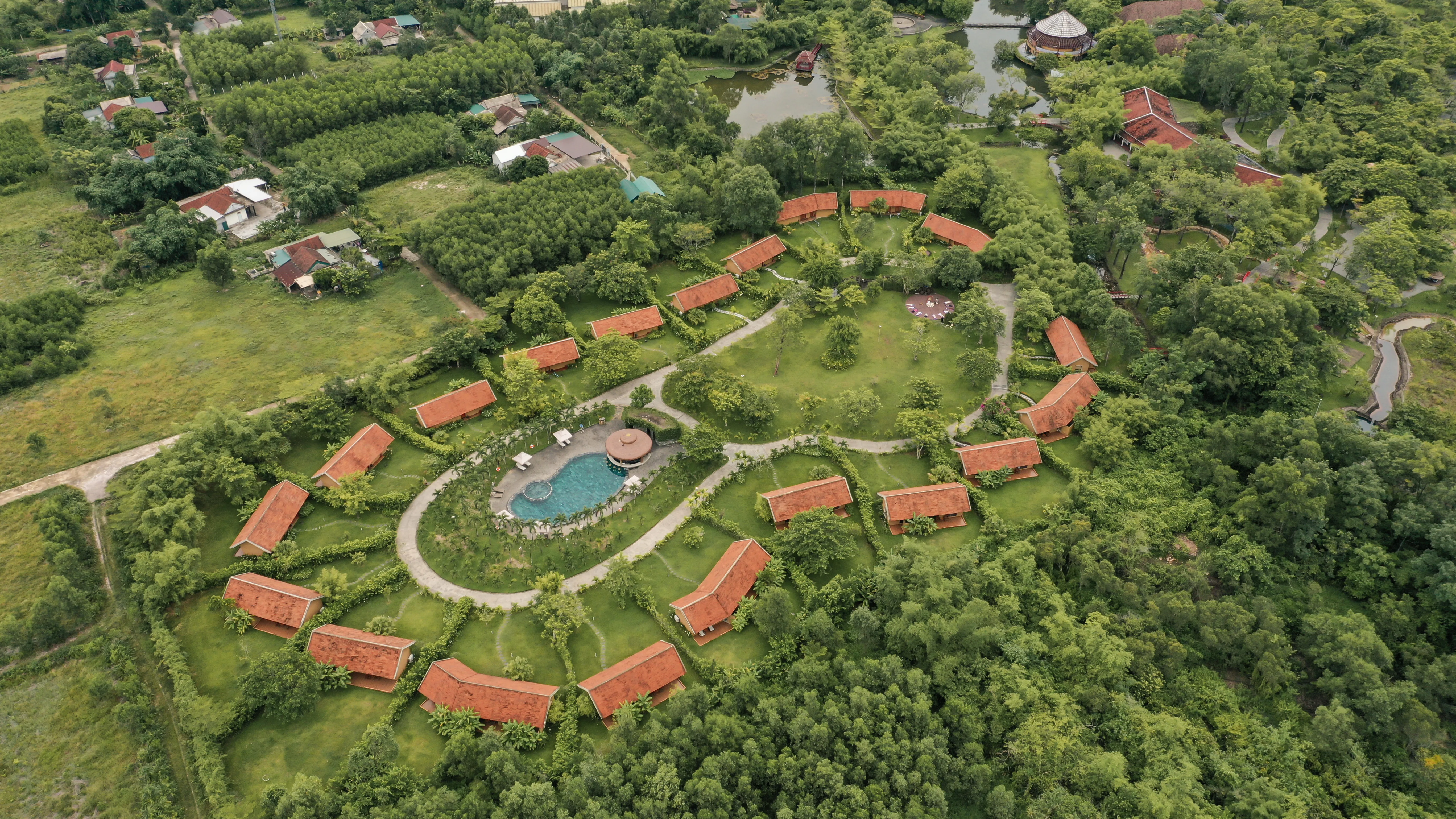 Drone view of the circular bungalow layout at Alba Wellness Valley Hue