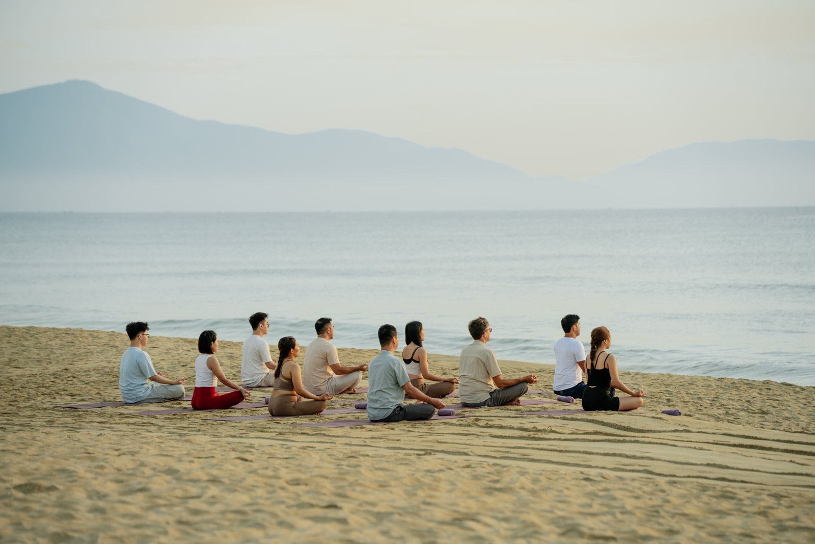 Hồi Retreat guests sitting quietly together by the sea