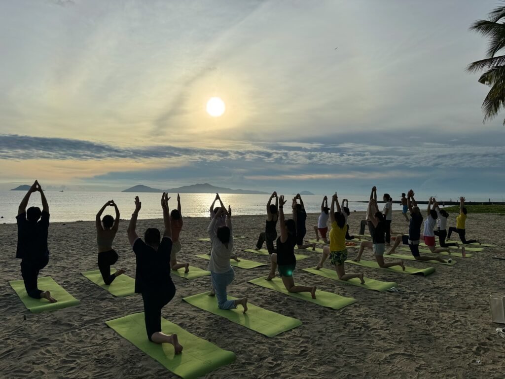 Vietnam Detox guests doing strength and mobility exercises outdoors